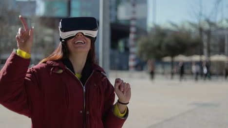 Joyful-mature-woman-experiencing-virtual-reality-glasses